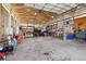 Spacious garage with multiple cars, tools and ample storage for projects and equipment at 16665 Kenuil St, Brighton, CO 80603