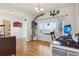 Inviting home office featuring hardwood floors, natural light, and a functional workspace at 16665 Kenuil St, Brighton, CO 80603