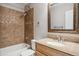 This bathroom features a shower over tub with decorative tiles, and a granite vanity at 4997 Collinsville Pl, Highlands Ranch, CO 80130