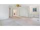 Spacious bedroom with neutral carpet, with access to a bathroom and walk-in closet at 72 S Nome St, Aurora, CO 80012
