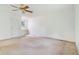 Bright bedroom with a ceiling fan and a built-in vanity near a sunlit window at 72 S Nome St, Aurora, CO 80012