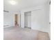 Bright bedroom featuring a closet and neutral carpet at 72 S Nome St, Aurora, CO 80012