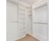 Organized walk-in closet features built-in shelves and ample hanging space at 72 S Nome St, Aurora, CO 80012