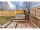 Backyard showcasing a small metal stock tank pool enclosed by a wooden fence at 10212 Kelliwood Way, Highlands Ranch, CO 80126