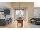 Open dining area with hardwood flooring and natural light flowing in from sliding glass doors at 10212 Kelliwood Way, Highlands Ranch, CO 80126