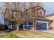 Charming two-story home with a two-car garage and manicured lawn at 10212 Kelliwood Way, Highlands Ranch, CO 80126