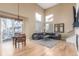 Spacious living room featuring a vaulted ceiling, fireplace, and hardwood flooring at 10212 Kelliwood Way, Highlands Ranch, CO 80126