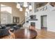 Bright and airy living room featuring hardwood floors, high ceilings, and a cozy fireplace at 10212 Kelliwood Way, Highlands Ranch, CO 80126