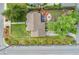 Aerial view of a manicured backyard, complete with a deck and stone firepit area, creating an inviting and private outdoor space at 1691 Roslyn St, Denver, CO 80220