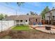 Brick home with a well maintained backyard features a deck area and a nice patch of artificial turf at 1691 Roslyn St, Denver, CO 80220