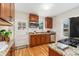 Well-lit kitchen featuring stainless steel appliances, granite countertops, and hardwood floors at 1691 Roslyn St, Denver, CO 80220