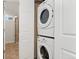 Convenient laundry area with stackable washer and dryer and the bathroom is conveniently located next to it at 1691 Roslyn St, Denver, CO 80220
