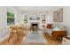 Bright living room featuring hardwood floors, fireplace, ample seating and natural light at 1691 Roslyn St, Denver, CO 80220