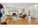 Bright living room featuring hardwood floors, fireplace, ample seating and natural light at 1691 Roslyn St, Denver, CO 80220