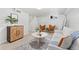Cozy living room features stylish furniture, white walls and neutral decor creating a relaxing atmosphere at 1691 Roslyn St, Denver, CO 80220
