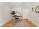 Bright office space showcasing hardwood floors, modern desk, and stylish decor at 1691 Roslyn St, Denver, CO 80220