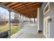 Covered deck looking out to a lush backyard at 13313 Elizabeth St, Thornton, CO 80241