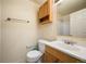 Bathroom with wood vanity, shower, and toilet at 13313 Elizabeth St, Thornton, CO 80241