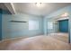 Bedroom featuring blue walls, mirrored closet and carpet at 13313 Elizabeth St, Thornton, CO 80241