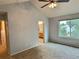 Spacious bedroom with a large window and neutral tones, ready for personalization at 13313 Elizabeth St, Thornton, CO 80241