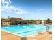 Large community pool and recreational area with ample lounge seating and shade at 13313 Elizabeth St, Thornton, CO 80241