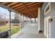 View of the covered deck, wooden steps, and backyard with a trampoline at 13313 Elizabeth St, Thornton, CO 80241