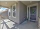 Inviting front porch with a dark-colored front door adorned with a decorative wreath at 7167 Hyland Hills St, Castle Pines, CO 80108