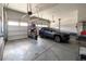 Spacious two car garage with ample storage and a vehicle at 7167 Hyland Hills St, Castle Pines, CO 80108