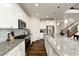 Stylish kitchen with stainless steel appliances, granite countertops and lots of natural light at 7167 Hyland Hills St, Castle Pines, CO 80108