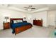 Bright main bedroom featuring tray ceilings, neutral walls, a king bed, and two dressers on carpeted floors at 7167 Hyland Hills St, Castle Pines, CO 80108