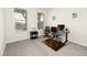 Bright, carpeted home office space with two desks, dual windows, and neutral decor at 7167 Hyland Hills St, Castle Pines, CO 80108