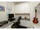 Home office with built-in storage cabinets and a computer setup at 7167 Hyland Hills St, Castle Pines, CO 80108