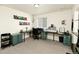 Home office space with multiple workstations, carpeted floors, neutral walls, and natural light from the window at 7167 Hyland Hills St, Castle Pines, CO 80108
