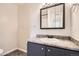 Clean bathroom with modern vanity, mirror, and neutral tones for a calming experience at 8770 Corona St # 102, Denver, CO 80229