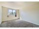 Comfortable bedroom with plush carpet and a well-lit window for a bright, airy feel at 8770 Corona St # 102, Denver, CO 80229