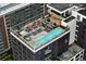Aerial view of a rooftop pool and lounge area on top of a modern apartment building at 1750 Wewatta St # 1720, Denver, CO 80202