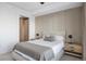 Cozy bedroom with city views, showcasing a neutral color scheme and modern furnishings, creating a tranquil space at 1750 Wewatta St # 1720, Denver, CO 80202