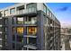 Modern apartment building with private balconies and large windows, featuring upscale urban living at 1750 Wewatta St # 1720, Denver, CO 80202