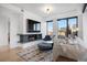 Stylish living room features a fireplace, sleek modern decor, and expansive windows showcasing the city skyline at 1750 Wewatta St # 1720, Denver, CO 80202