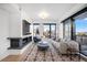 Stylish living room features a modern fireplace, large windows, and hardwood flooring at 1750 Wewatta St # 1720, Denver, CO 80202