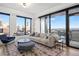 Bright living room featuring large windows with a city view and modern furniture at 1750 Wewatta St # 1720, Denver, CO 80202