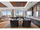 Bright living room with city views, hardwood floors, comfortable seating, and a decorative ceiling at 1750 Wewatta St # 1720, Denver, CO 80202