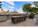 Outdoor rooftop with a table and stools overlooking the city skyline at 1750 Wewatta St # 1720, Denver, CO 80202