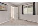 Cozy bedroom with gray carpet, window, and natural light at 5079 Morning Glory Pl, Highlands Ranch, CO 80130