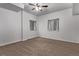 Spacious bedroom with neutral walls, carpet, and natural light from two windows at 5079 Morning Glory Pl, Highlands Ranch, CO 80130