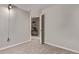 Neutral bedroom with gray carpet, base molding, and doorway to another room at 5079 Morning Glory Pl, Highlands Ranch, CO 80130