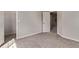 Neutral bedroom with gray carpet, base molding, and doorway to another room at 5079 Morning Glory Pl, Highlands Ranch, CO 80130