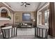 Comfortable living area with stylish seating, large windows, and unique decor at 5079 Morning Glory Pl, Highlands Ranch, CO 80130