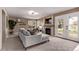 Comfortable living room has neutral tones, a fireplace and plush carpeting at 5079 Morning Glory Pl, Highlands Ranch, CO 80130