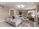 A spacious living room with lots of natural light, neutral colors and cozy decor at 5079 Morning Glory Pl, Highlands Ranch, CO 80130